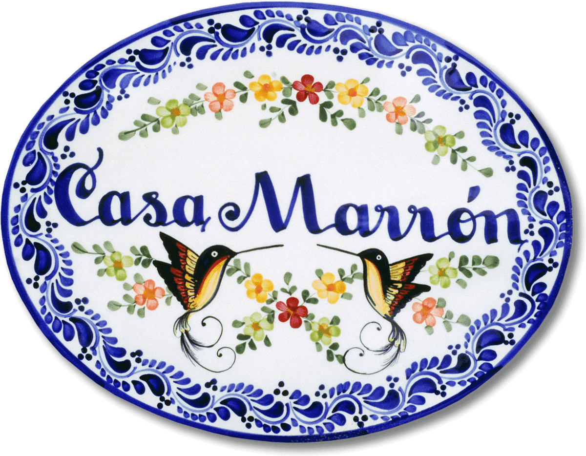 Hand-painted Talavera ceramic plaque reading Casa Marrón, decorated with hummingbirds and flowers